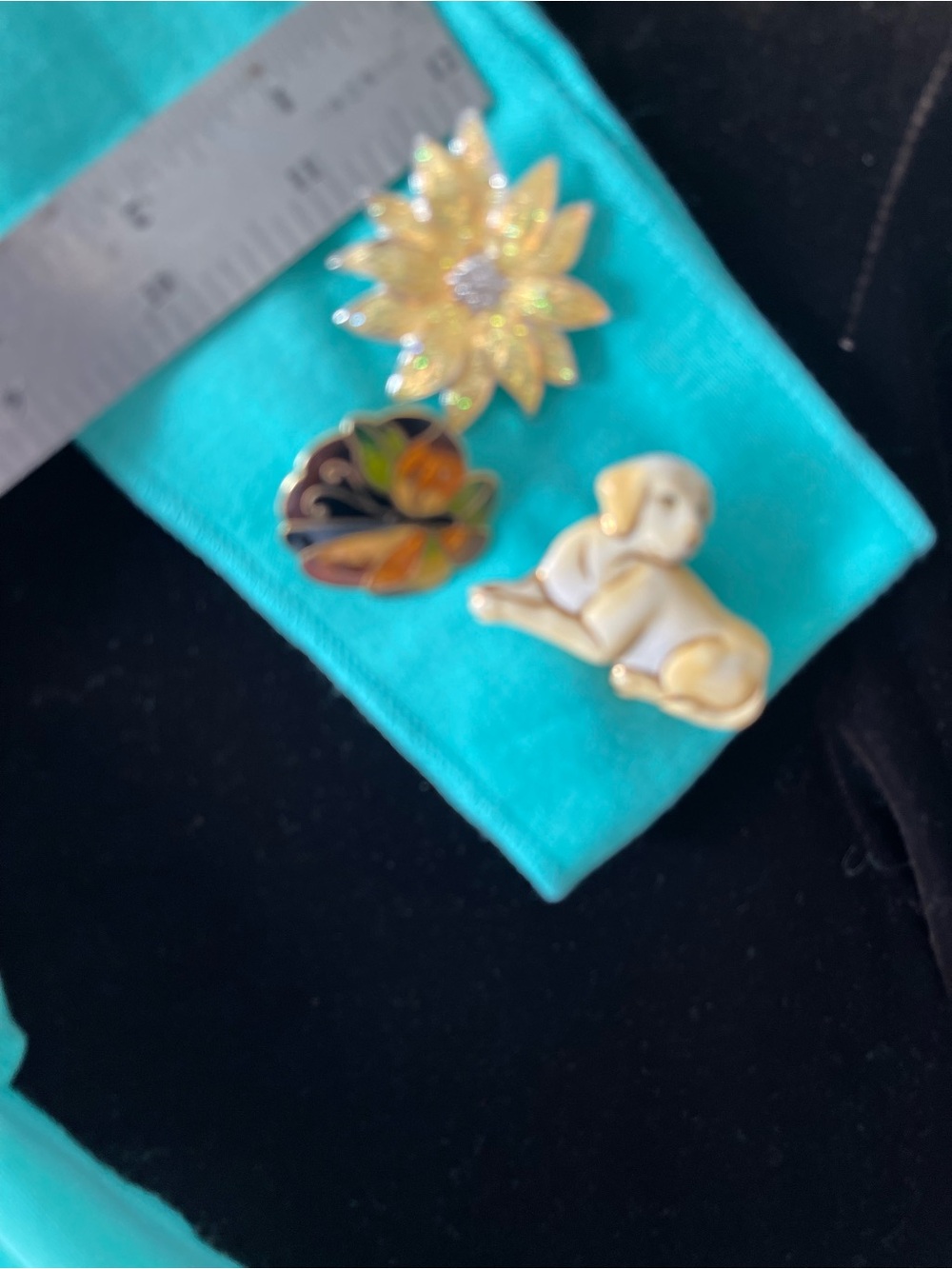 Three Enamel Pins - Sunflower, Floral Swirl, White Puppy scarf and earrings.